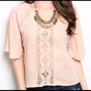 Beautiful pink lace trimmed blouse.